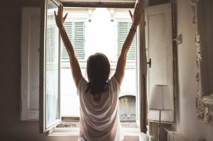 woman-stretching-by-a-window-1