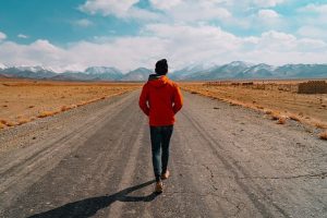 woman-walking-down-empty-road